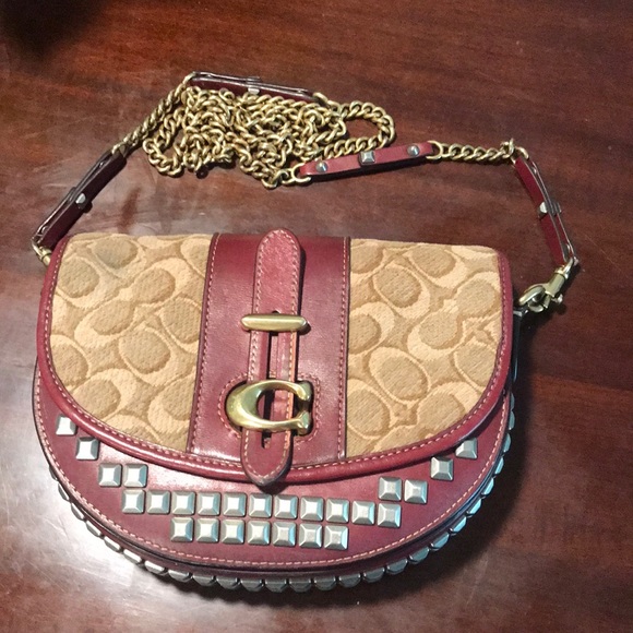 Coach Handbags - Selling my Coach purse. It’s burgundy, brown, tan & has silver & brass accents.